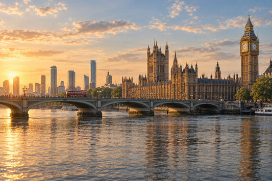 London's Houses of Parliament and a bridge over the Thames at sunset
