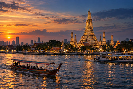 Temple spire on the Chao Phraya River in Bangkok at dusk